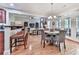 Open floor plan featuring light-filled dining area leading into a kitchen with an eat-in bar at 1076 Pinyan Ln, Canton, GA 30115