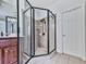 Modern bathroom with corner shower featuring glass enclosure and tile surround at 1076 Pinyan Ln, Canton, GA 30115