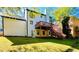 Backyard view of the home featuring deck, patio, and yard at 430 Thornbush Trce, Lawrenceville, GA 30046