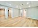 Finished basement with hardwood floors featuring access to other rooms at 430 Thornbush Trce, Lawrenceville, GA 30046