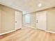 Finished basement with hardwood floors featuring access to other rooms at 430 Thornbush Trce, Lawrenceville, GA 30046