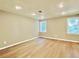 Bright basement showcasing the new hardwood floors and recessed lighting at 430 Thornbush Trce, Lawrenceville, GA 30046