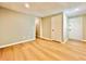 Finished basement with hardwood floors featuring access to other rooms at 430 Thornbush Trce, Lawrenceville, GA 30046