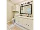 Bathroom with double sink vanity with granite counters, and a full sized mirror at 430 Thornbush Trce, Lawrenceville, GA 30046