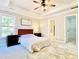 Bright bedroom with trey ceiling, large window, and attached bathroom at 430 Thornbush Trce, Lawrenceville, GA 30046