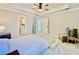 Spacious primary bedroom featuring trey ceilings, and a door leading to the primary bathroom at 430 Thornbush Trce, Lawrenceville, GA 30046