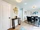 Inviting dining room featuring modern decor, stylish lighting, and seamless flow to the living space at 430 Thornbush Trce, Lawrenceville, GA 30046