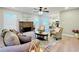Cozy living room with fireplace, hardwood floors, neutral paint, and seamless access to the kitchen at 430 Thornbush Trce, Lawrenceville, GA 30046
