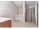 Bathroom with a soaking tub and patterned shower curtain at 6341 Lake Valley Pt, Lithonia, GA 30058