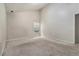 Spacious bedroom features a large window and neutral color scheme at 6341 Lake Valley Pt, Lithonia, GA 30058