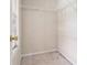 Small closet with a wire shelf and natural light at 6341 Lake Valley Pt, Lithonia, GA 30058