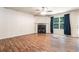 Spacious living room features a fireplace, windows, and laminate flooring at 6341 Lake Valley Pt, Lithonia, GA 30058