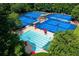 Aerial of community pool and tennis courts surrounded by lush landscaping at 710 Larkspur Nw Blvd, Acworth, GA 30102