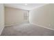 Bedroom featuring neutral walls, carpet, and a window at 1755 Rutland Pass Dr, Lawrenceville, GA 30045