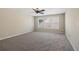 A bright bedroom offers neutral walls, plush carpet, and a ceiling fan for added comfort at 1755 Rutland Pass Dr, Lawrenceville, GA 30045