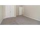 A bedroom featuring carpet, neutral walls and closet with bi-fold doors at 1755 Rutland Pass Dr, Lawrenceville, GA 30045