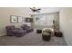 Bright bonus room featuring large windows, plush furniture, and indoor plants at 1755 Rutland Pass Dr, Lawrenceville, GA 30045