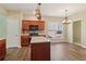 Kitchen with stainless steel appliances, granite countertops, wood cabinets, and an island at 1755 Rutland Pass Dr, Lawrenceville, GA 30045