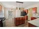 Well-equipped kitchen with a center island, stainless steel range, and view into living spaces at 1755 Rutland Pass Dr, Lawrenceville, GA 30045