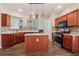 Well-equipped kitchen with a center island, stainless steel range, and tile backsplash at 1755 Rutland Pass Dr, Lawrenceville, GA 30045