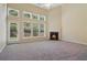 Bright living room with tall windows and a cozy fireplace at 1755 Rutland Pass Dr, Lawrenceville, GA 30045