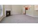 Open living space featuring fireplace and view into kitchen at 1755 Rutland Pass Dr, Lawrenceville, GA 30045