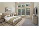 Spacious main bedroom with many windows, natural light, and neutral decor at 1755 Rutland Pass Dr, Lawrenceville, GA 30045