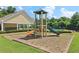Community playground featuring a slide and climbing structure near the pool, set within a well-maintained area at 1755 Rutland Pass Dr, Lawrenceville, GA 30045