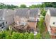 Aerial shot of the back of the house showing the deck, patio, and well-maintained backyard at 1830 Secretariat Gait Way, Suwanee, GA 30024