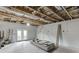 Unfinished basement with exposed ceiling and walk-out doors at 1830 Secretariat Gait Way, Suwanee, GA 30024