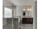 Bright bathroom featuring double vanity, soaking tub, and glass-enclosed shower at 1830 Secretariat Gait Way, Suwanee, GA 30024