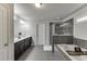Bathroom with dual sinks, soaking tub, and tiled shower at 1830 Secretariat Gait Way, Suwanee, GA 30024