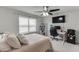 Relaxing bedroom with carpet, ceiling fan, large window, and comfortable bed at 1830 Secretariat Gait Way, Suwanee, GA 30024
