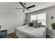 Serene bedroom with hardwood floors, soft bedding, a large window, and stylish furniture at 1830 Secretariat Gait Way, Suwanee, GA 30024