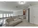 Bright bonus room with carpeted floors, access to storage, and staircase with decorative railing at 1830 Secretariat Gait Way, Suwanee, GA 30024
