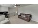 Comfortable bonus room area with carpeted floors and a staircase with decorative railing at 1830 Secretariat Gait Way, Suwanee, GA 30024