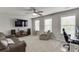 Cozy upstairs bonus room with large windows, ideal for a home office or media space at 1830 Secretariat Gait Way, Suwanee, GA 30024