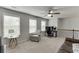 Spacious bonus room features large windows, carpeted floors, ceiling fan, and neutral paint at 1830 Secretariat Gait Way, Suwanee, GA 30024