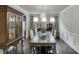 Traditional dining room with a large dining table, decorative chandelier and elegant furnishings perfect for hosting gatherings at 1830 Secretariat Gait Way, Suwanee, GA 30024