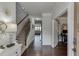 Elegant foyer featuring hardwood floors, staircase, decorative lighting and an adjacent office space with French doors at 1830 Secretariat Gait Way, Suwanee, GA 30024