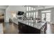 Modern kitchen island with granite countertops and open floor plan, great for entertaining at 1830 Secretariat Gait Way, Suwanee, GA 30024