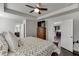 Comfortable main bedroom with en-suite bathroom access and dresser at 1830 Secretariat Gait Way, Suwanee, GA 30024