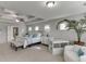 Spacious main bedroom with tray ceiling, carpet floors, lots of light, and adjoining bathroom at 1830 Secretariat Gait Way, Suwanee, GA 30024