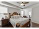 Main bedroom with tray ceiling, dark wood floors, and decorative furnishings at 1830 Secretariat Gait Way, Suwanee, GA 30024