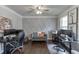 Bright home office with modern decor, dual workstations, hardwood floors, and detailed wall trim at 1830 Secretariat Gait Way, Suwanee, GA 30024