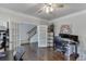 Comfortable office space showcasing french doors, hardwood floors, neutral tones and functional decor at 1830 Secretariat Gait Way, Suwanee, GA 30024