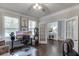 Versatile office area showcasing hardwood floors, french doors, bright natural light and neutral decor at 1830 Secretariat Gait Way, Suwanee, GA 30024