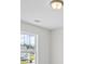 Bright bedroom with natural light streaming through the large window, creating a warm, inviting atmosphere at 230 Waters Edge Pkwy, Temple, GA 30179