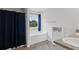 This bathroom features a tub, shower with a blue curtain, and double vanity with granite countertops at 230 Waters Edge Pkwy, Temple, GA 30179
