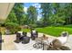 Landscaped backyard featuring patio furniture and lush green lawn, ideal for outdoor living at 2463 Briarmoor Ne Rd, Atlanta, GA 30345